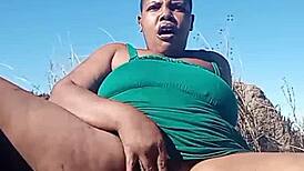 Chubby slut masturbates her fat hairy pussy in public bush