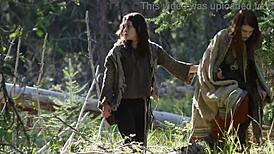 Girl masturbating outdoors next to another chick