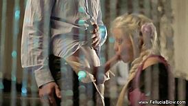 A blonde milf strips naked and gives a clothed guy a blowjob.