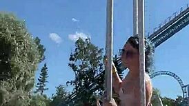 She gives a cute blowjob in public on the ferris wheel