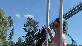 She gives a cute blowjob in public on the ferris wheel