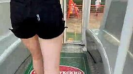 She gives a cute blowjob in public on the ferris wheel