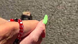 She gives a cute blowjob in public on the ferris wheel