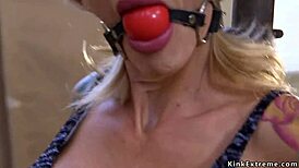 Blonde with big tits submits in rough bondage group