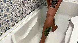 Latex dominatrix Nika showers in red fetish dress