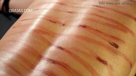 Domina Whips Her Redhead Slave in Tight Bondage