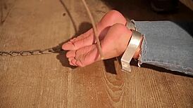 Aspiring slave endures falaka punishment in audition.