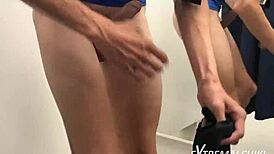 in the hot fitting room, a sporty twink gives an intense handjob leading to a cumshot