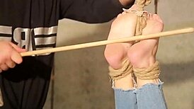 Aspiring slave endures falaka punishment in audition.