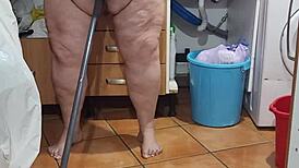 I piss abundantly on the kitchen floor and enjoy it so much that I fuck the broom