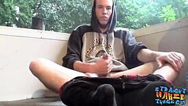 Naked homosexual thug smokes outdoors while masturbating his big hairy cock to cumshot