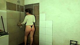I recorded this mature brunette cleaning in skimpy clothes at home