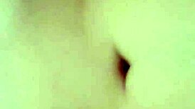 Tanned latina flaunting her natural tits and juicy pussy in a lively display.