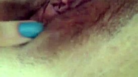 Tanned latina flaunting her natural tits and juicy pussy in a lively display.