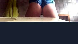 Blonde girl records her big ass and tits in the bathroom webcam solo.