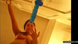 Alexis 19 fucks blue dildo mounted on door and squirts all over her pussy.