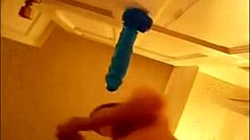 Alexis 19 fucks blue dildo mounted on door and squirts all over her pussy.