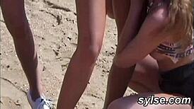 Lesbian Teens and MILFs Engage in Public Beach Orgy