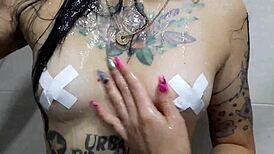Dominatrix Nika Seduces with Tits in Shower