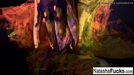 Discover busty Natasha's sexy solo masturbation under black lights
