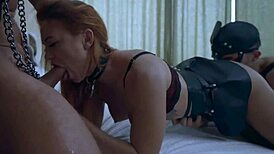 Masked slavegirl in deep throat session.