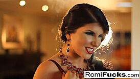 Romi smokes while fingering her wet pussy