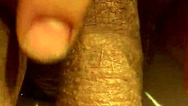 Guy jerks his soft cock in the bathroom