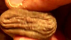 Guy jerks his soft cock in the bathroom