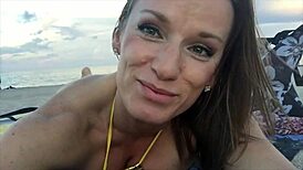 jillian teases at beach in tiny gold bikini outfit.