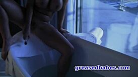 Busty milf charity mclain oils her bikini body and masturbates with glass dildo