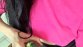 suggestive mature woman spreads legs for cucumber masturbation massage