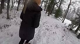 Beauty Blonde Caught in a Fierce Snow Storm Outdoors