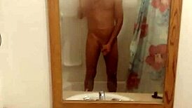 Girl plays innocently in the bath, bathing and showering without any adult themes.