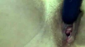 Shaved Babe Inserts Vibrator In Bedroom