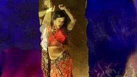 Teasing nude brunette dances erotically in oriental setting