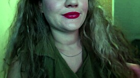 Cute woman paints her lips red and smokes a cigarette. I hope you like it.