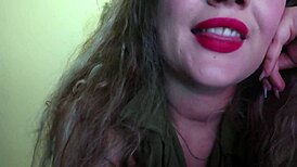 Cute woman paints her lips red and smokes a cigarette. I hope you like it.