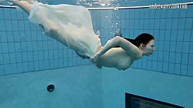 Andrea floats in the pool, showing her hottest ass underwater. 😍