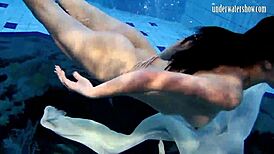 Andrea floats in the pool, showing her hottest ass underwater. 😍