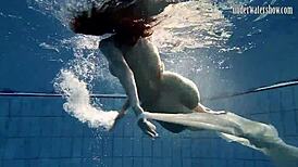 Andrea floats in the pool, showing her hottest ass underwater. 😍