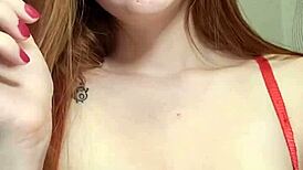 redhead lights up a cigarette and smokes