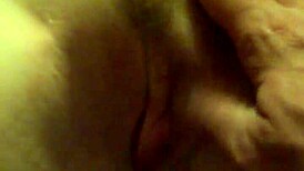 A redhead woman showcases her ginger-colored breasts in a natural setting.