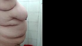 I'm home alone, bathing in the shower before playing with my dildo for intense pleasure.