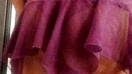 The transvestite models her outfit in the studio.