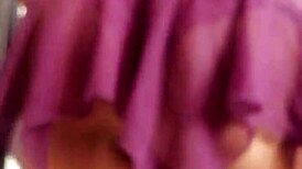 The transvestite models her outfit in the studio.