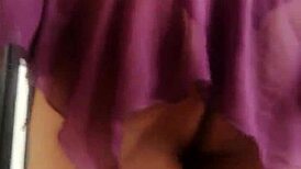 The transvestite models her outfit in the studio.