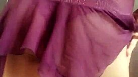 The transvestite models her outfit in the studio.