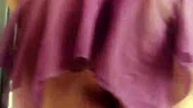 The transvestite models her outfit in the studio.