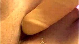 Fat woman enjoys herself with a dildo