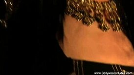 Erotic dancer in the night captivates with sensual moves and exotic allure under soft lights